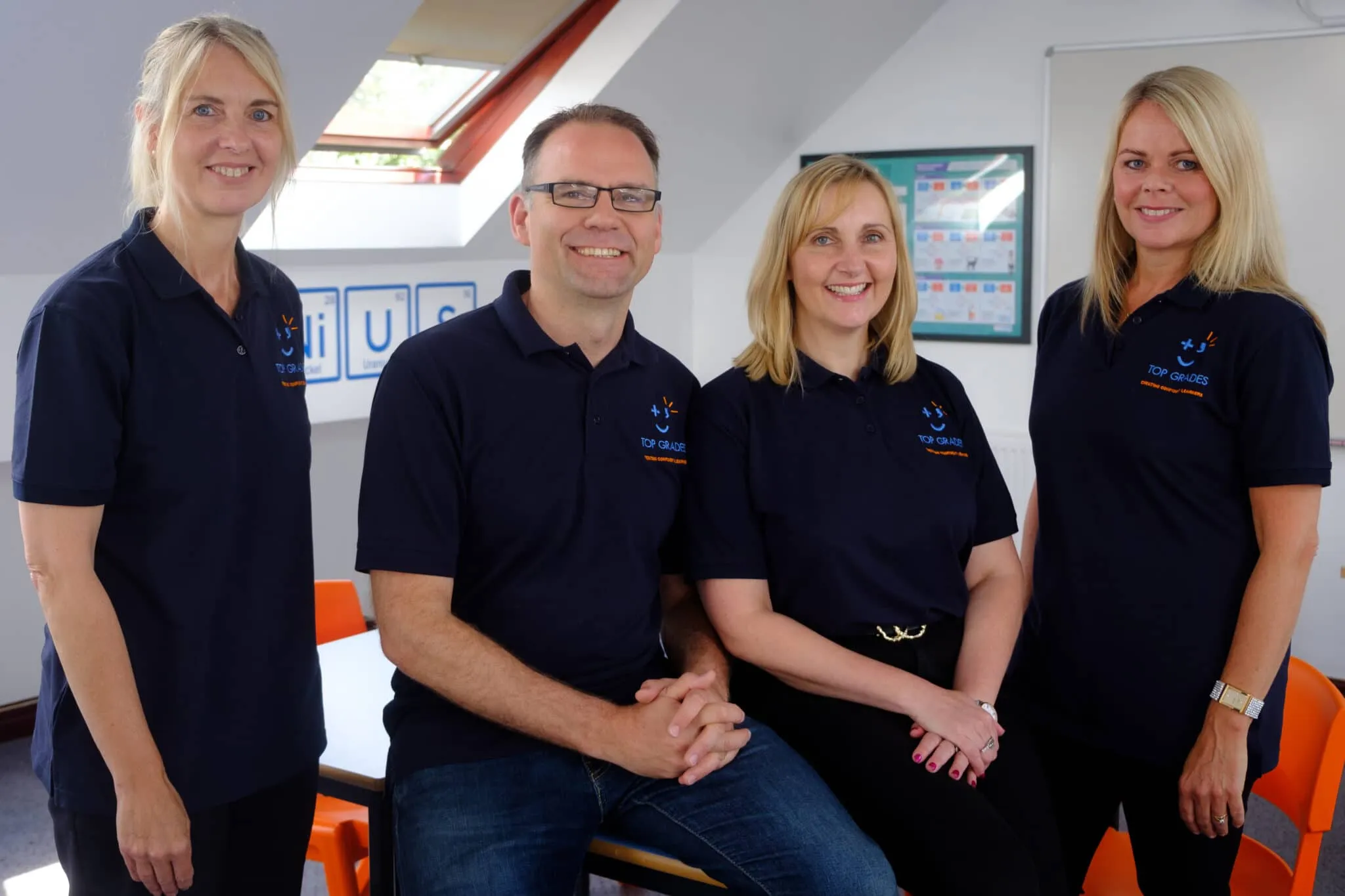 The Top Grades tutors, including Richard and Emma, in one of the centre's classrooms